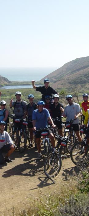Mountain biking group posing at the end of an amazing ride in the picturesque Tennessee Valley