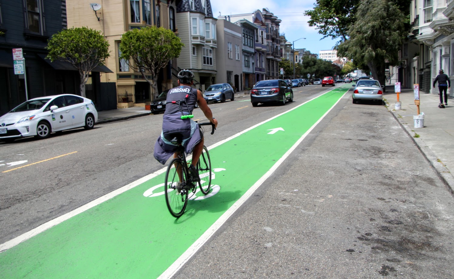 Biker on the Wiggle's green bike path in San Francisco