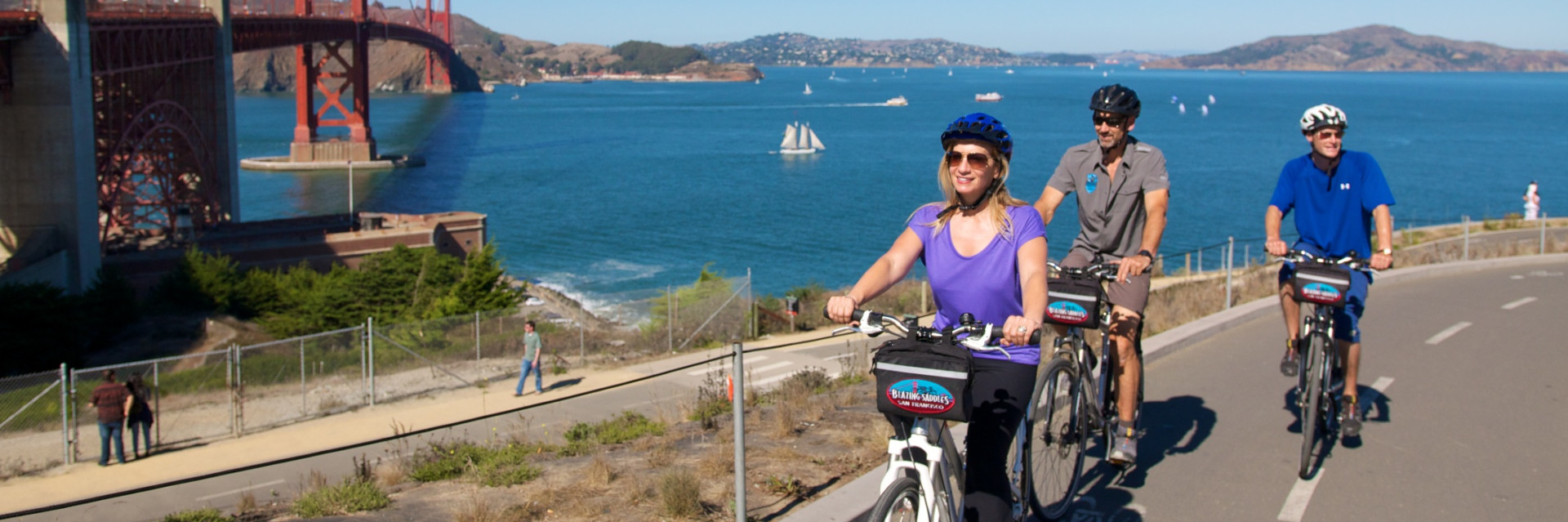 Bikers following the bike path to the Golden Gate Bridge on a beautiful sunny day