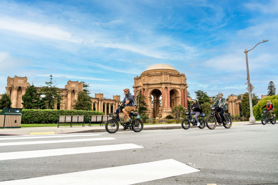 Riders near the Palace of Fine Arts preparing for a family route