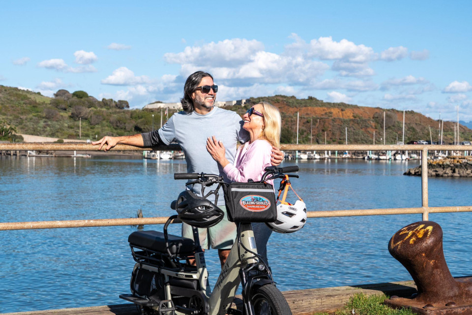 Couple riding near the bay on a calm daytime route