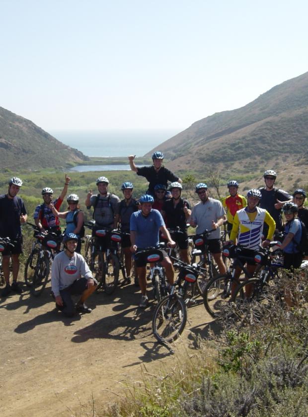 Mountain biking group posing at the end of an amazing ride in the picturesque Tennessee Valley