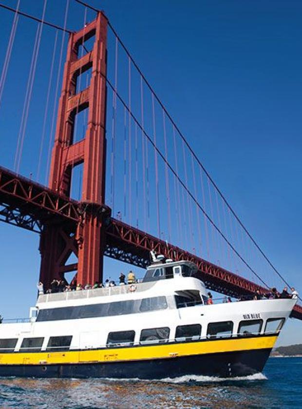 Blue & Gold Fleet boat sailing under the Golden Gate Bridge